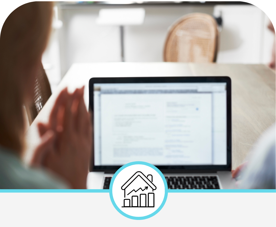 Professional woman working on a laptop in a modern office, analyzing data and conducting market research.